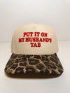 Put It On My Husbands Tab Trucker Hat